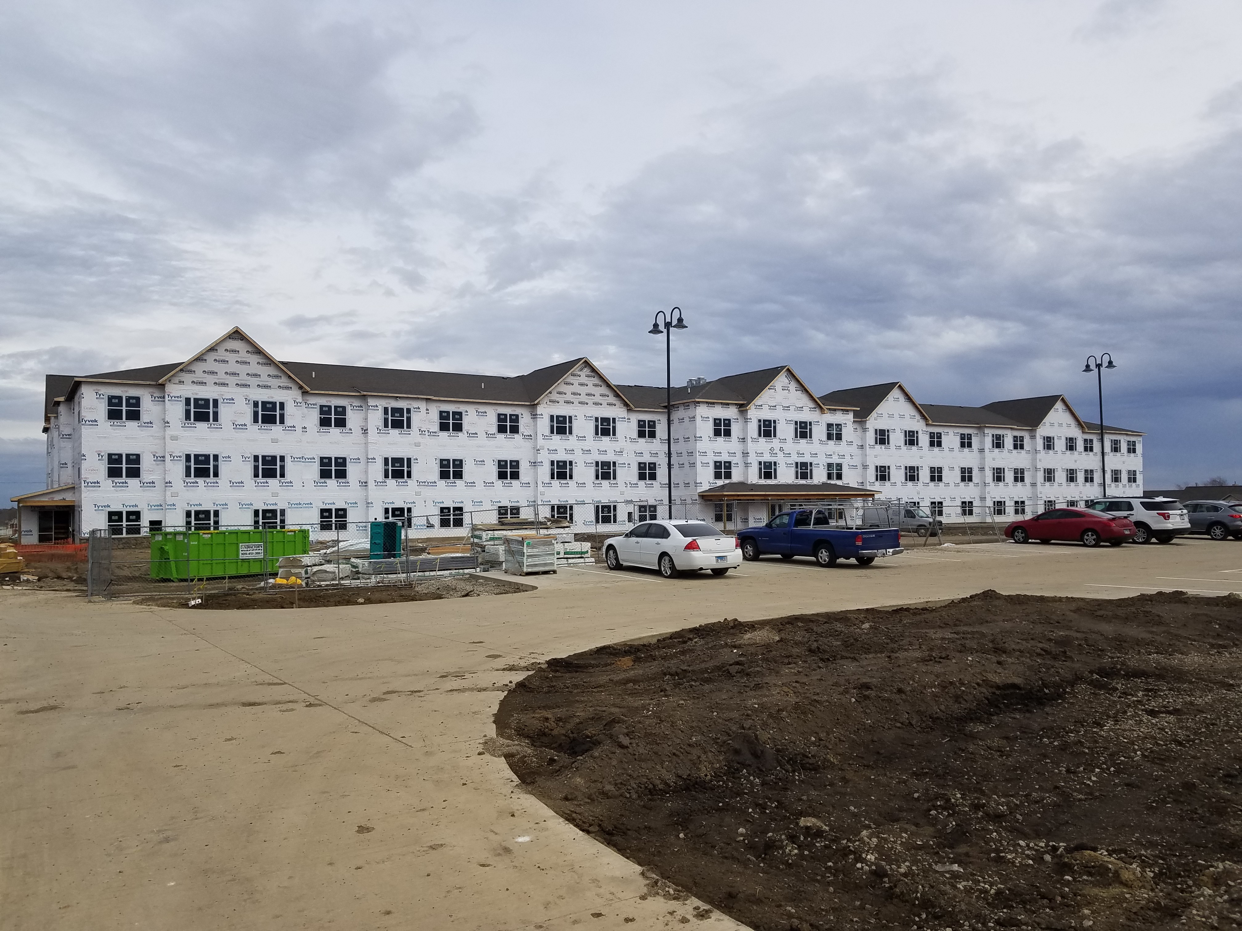 outside view of a 3 story apartment complex under construction