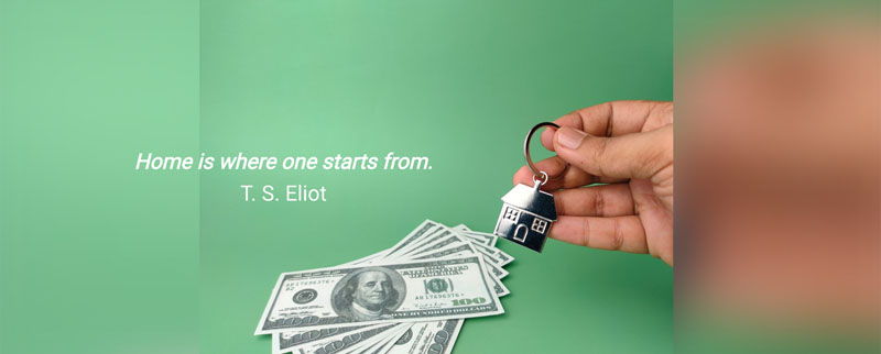 A key chain and money with text that reads: Home is where one starts from. T. S. Eliot.