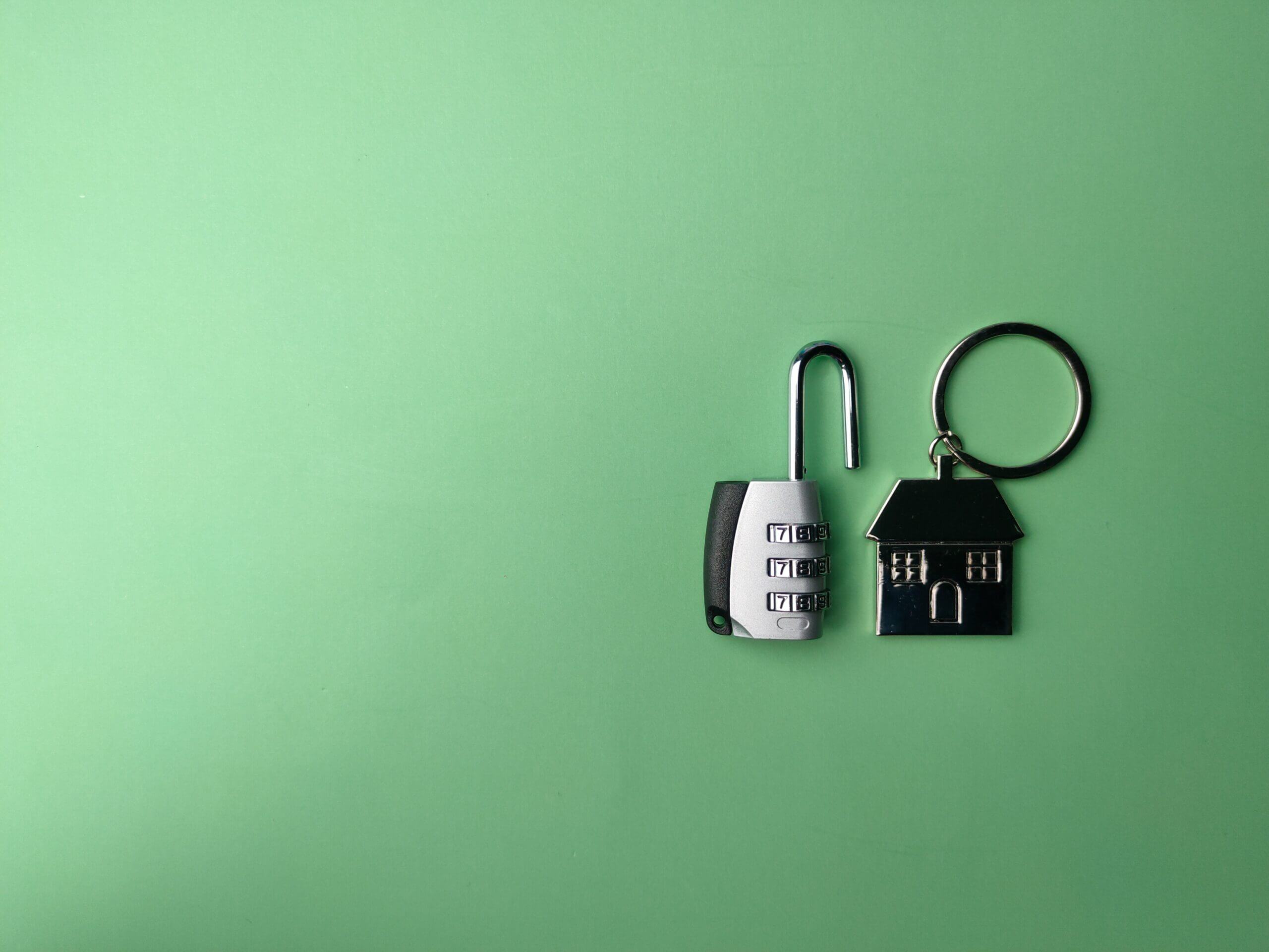 A lock with a house shaped key.