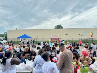 Event Attendees Gather to receive free snacks and school supplies 