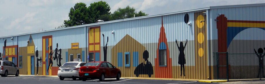 Boys and Girls Club with large design elements painted on the front of the building.