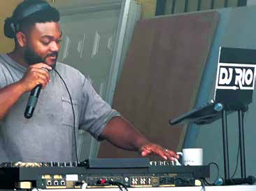 DJ Rio providing music and entertainment for attendees.