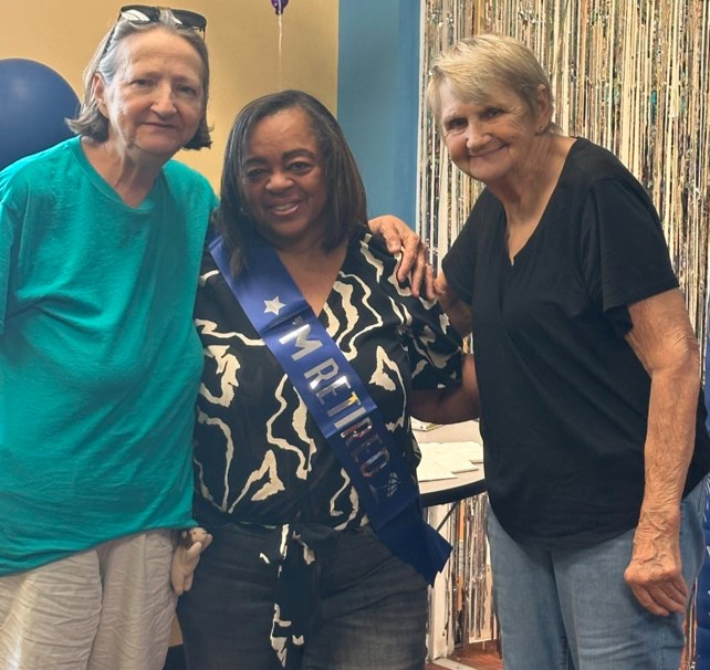 Ladies standing beside Murenda when she Retired from CHRC.