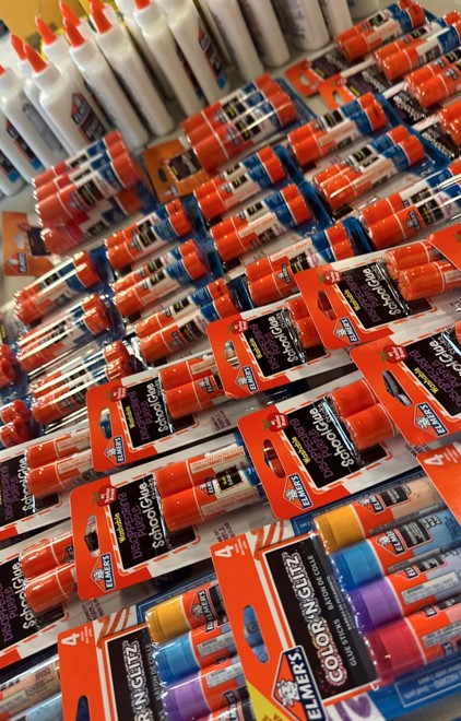 School supplies of glue at the 2024 Family Fun Day Back-to-School Bash.