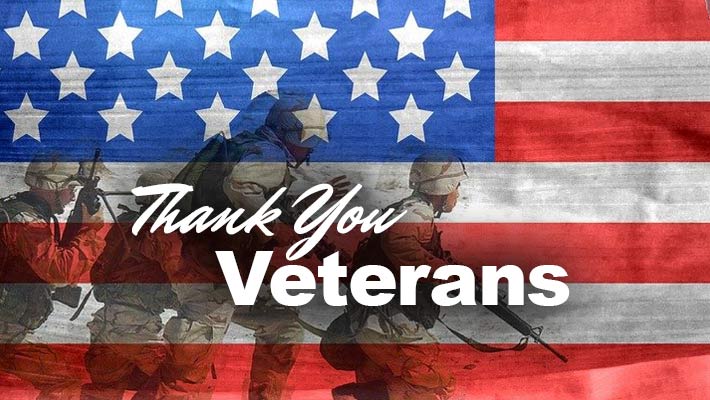 Thank You Veterans. A silhouette of soldiers on the American Flag.