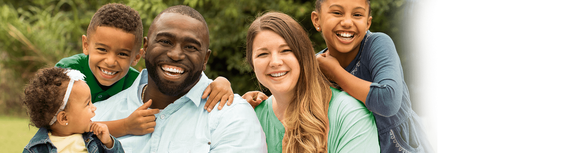 Resident family embracing in a group hug.