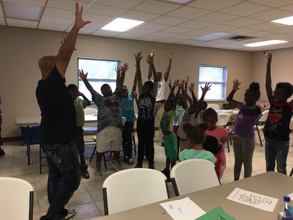 Teacher and students in Drama Class.