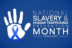 National Slavery and Human Trafficking Prevention Month. Handprint with ribbon on the palm.