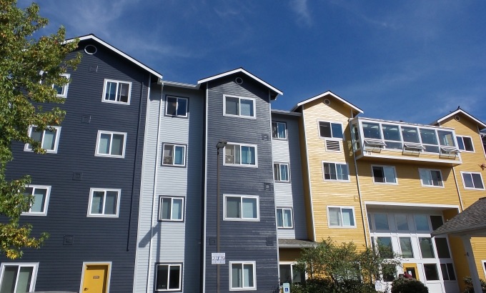 A black and yellow apartment building.
