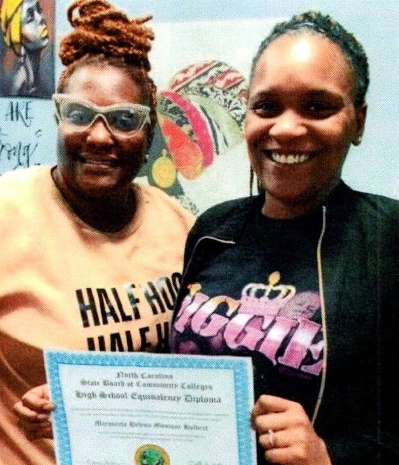 Kamicia Griffin (left) with Forest City Housing Authority resident Marqueeta Holbert.