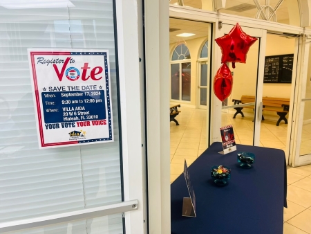 Flyer next to a table at the national voting day event.