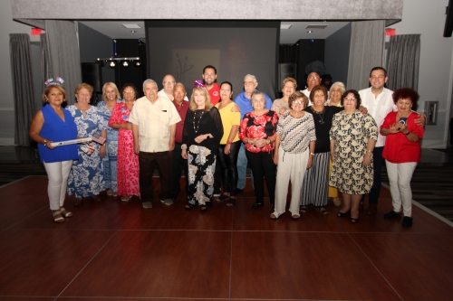 Group of people standing in line at the Fourth of July party.