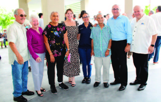 Various individuals standing together.