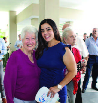 Two ladies standing side by side.