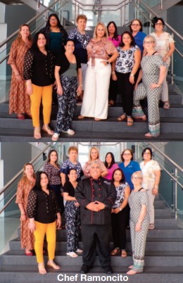 Chef Ramoncito standing with a group of women.