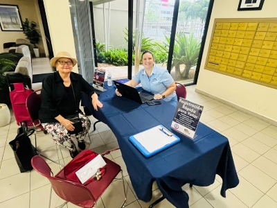 Ladies sitting at a table for National Voting Day.