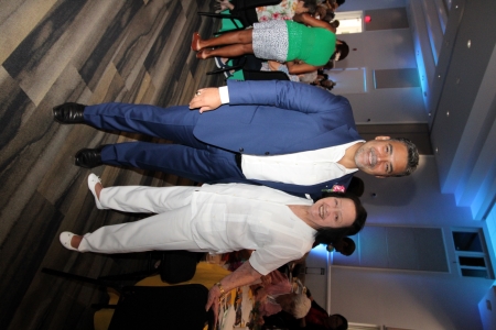 Man standing next to a woman.