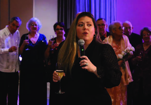 A woman speaking into a microphone.