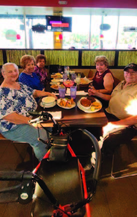 A group of individuals sitting at a restaurant.