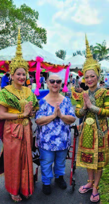 Three ladies standing together.