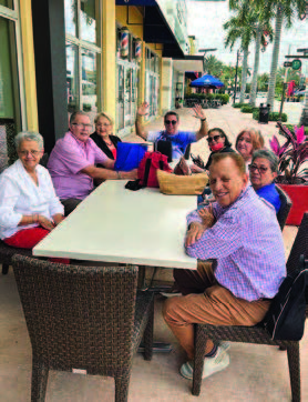 Individuals sitting at a table.