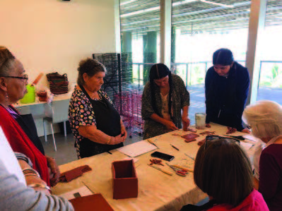 Individuals making crafts.