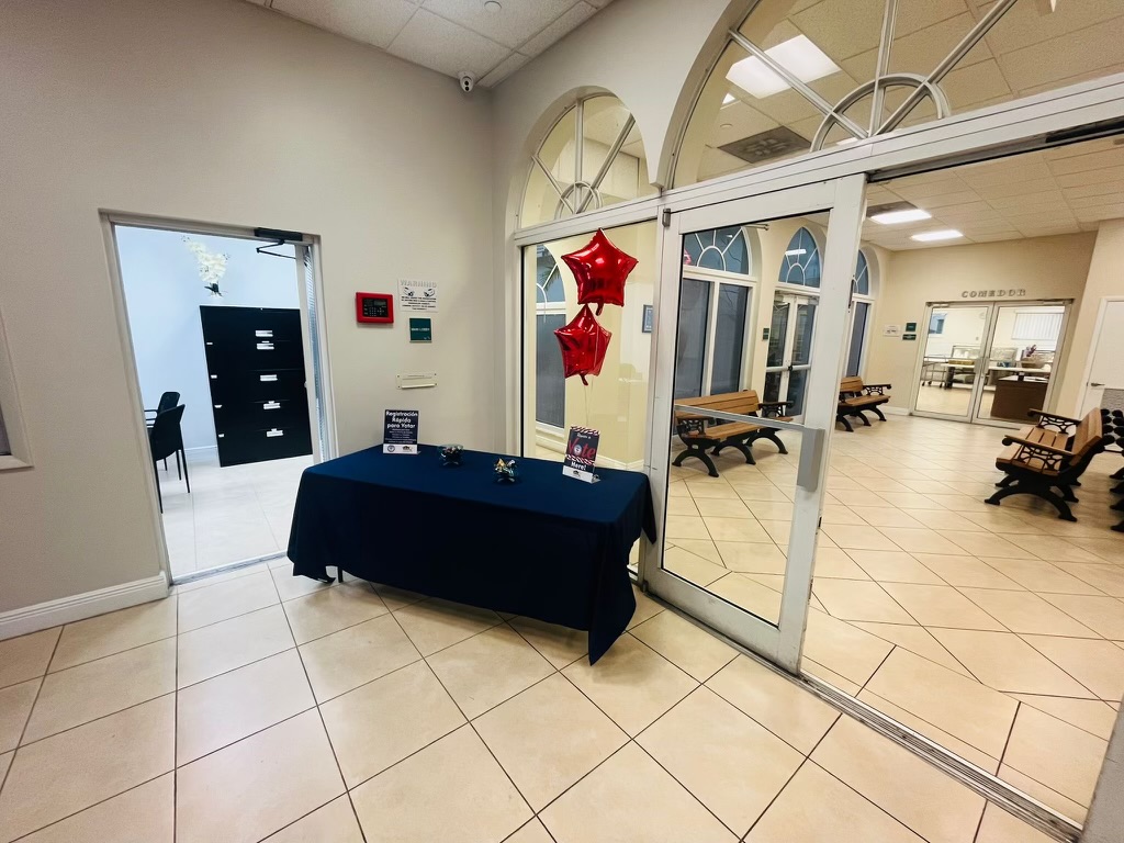 Table with information and balloons at the national voting day event.