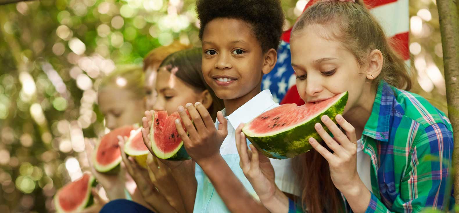 Kids at a watermelon-eating contest