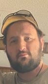 A picture of a white male with mustache and beard 