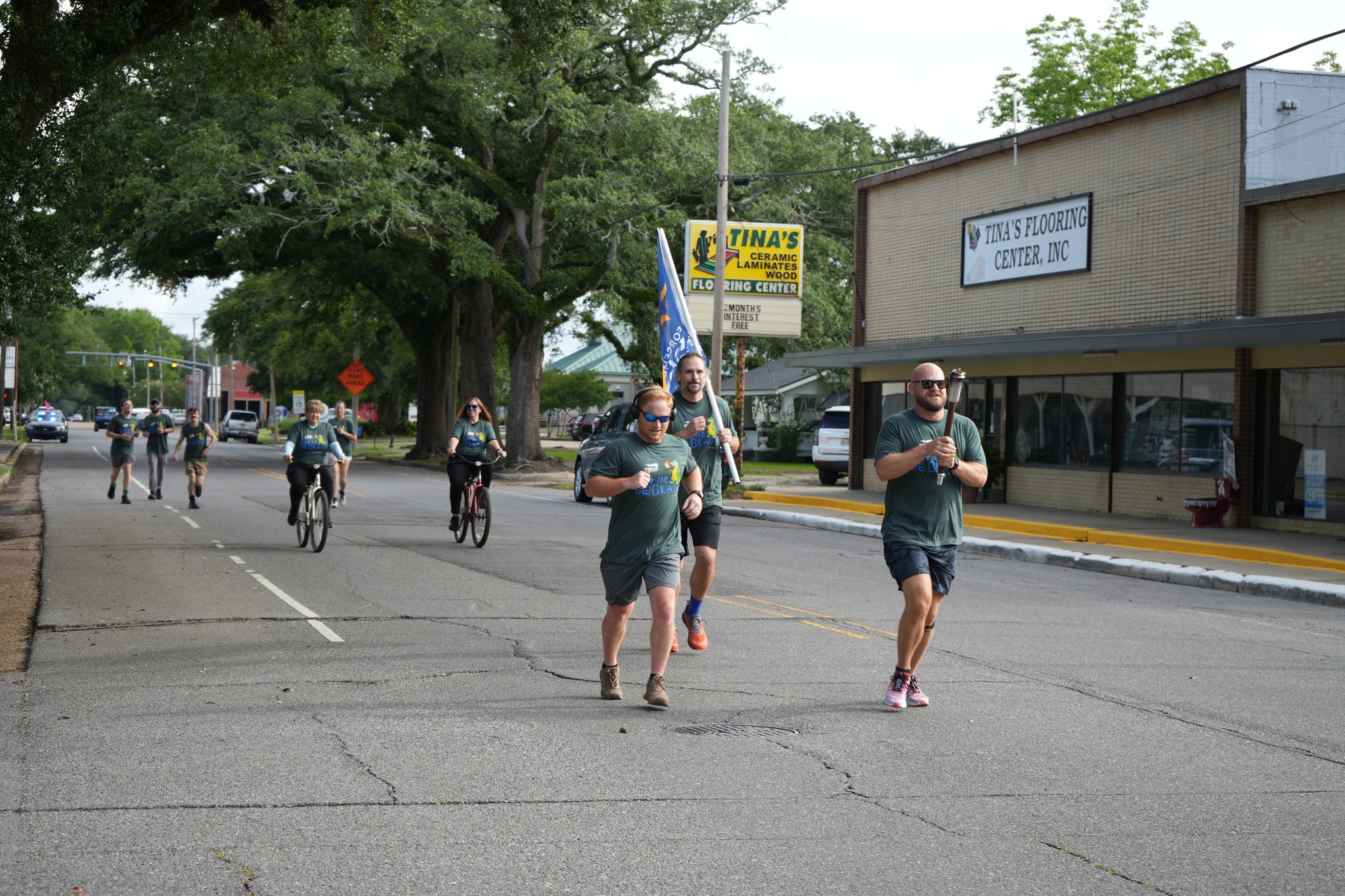 Freddie, Joseph, and Sparks running down main street