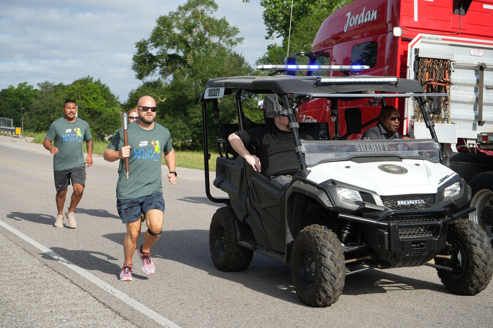 Commander Powell running with torch