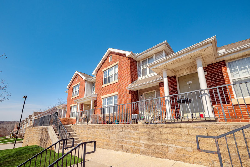 A home exterior with red brick.