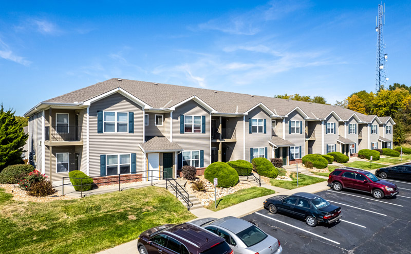 Townhomes with gray vinyl siding.