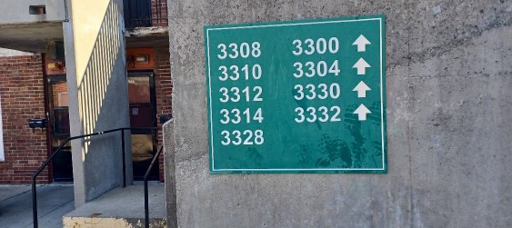 Typical signage to remove prior to power washing and sealing then reinstall.