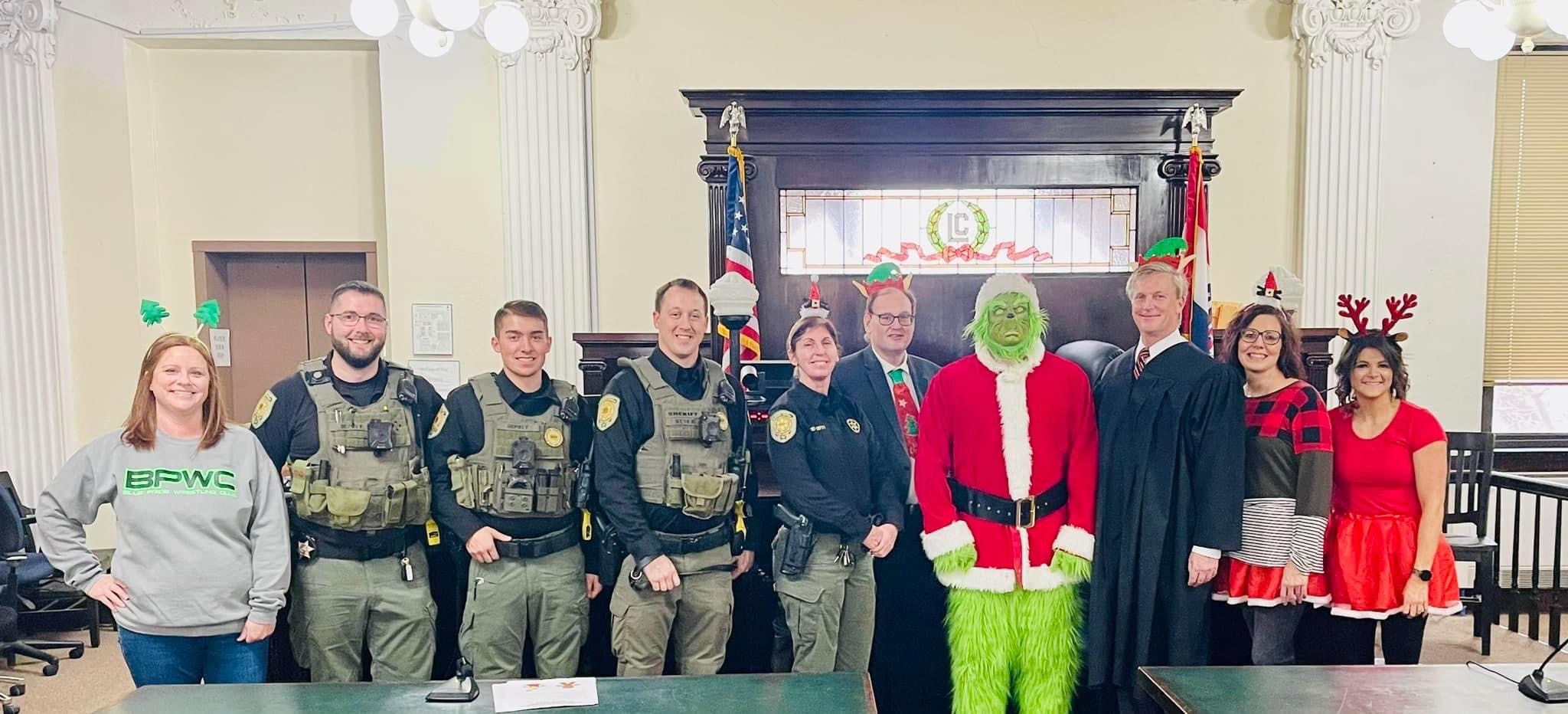 Linn County Staff with the Grinch in the courtroom