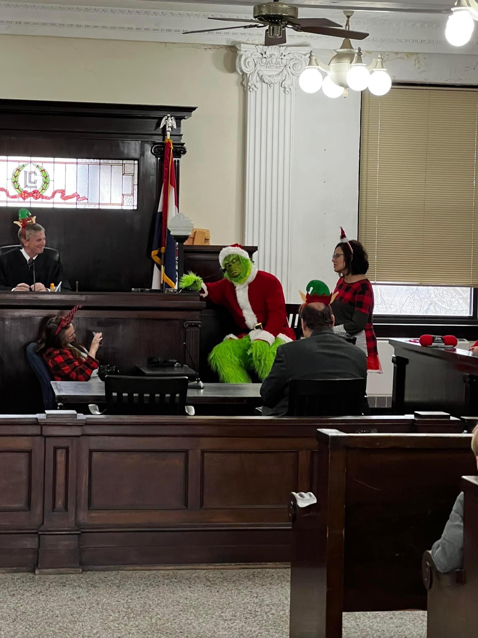 The Grinch testifying at the witness stand