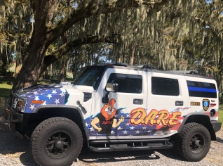 DARE Vehicle with DARE written across it and the Stars from the American Flag