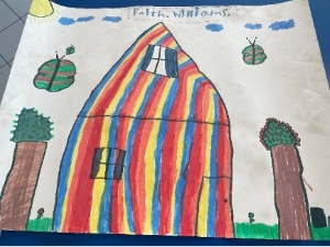 A rainbow house with trees, clouds, and flowers.