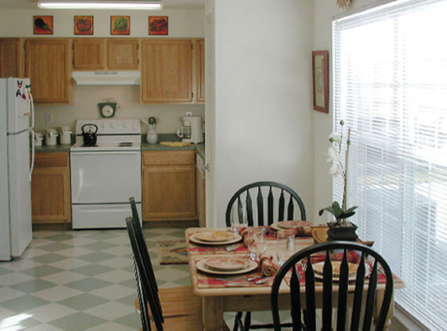 A kitchen with blue and white tiles