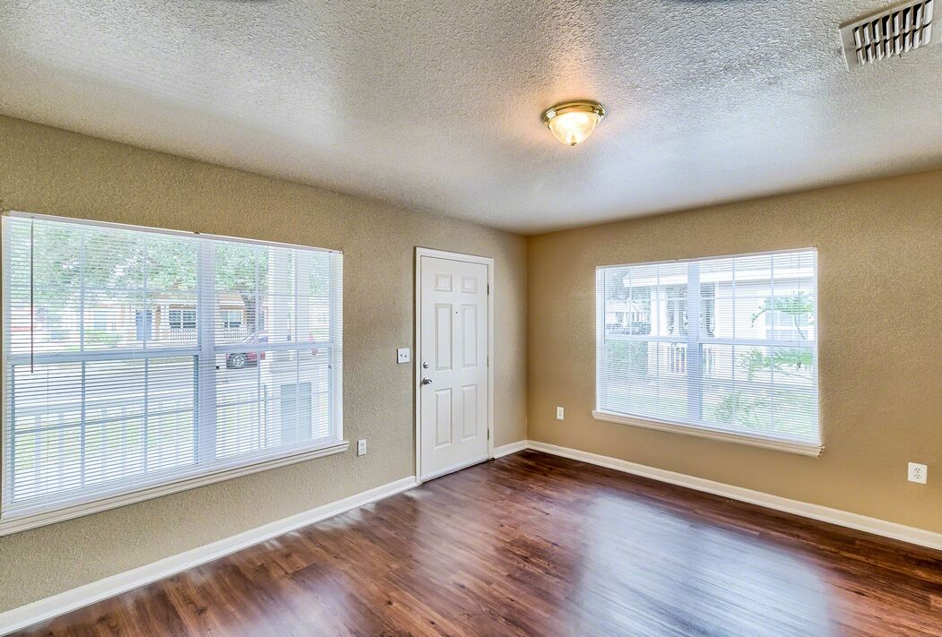 A living room with view of the front door.