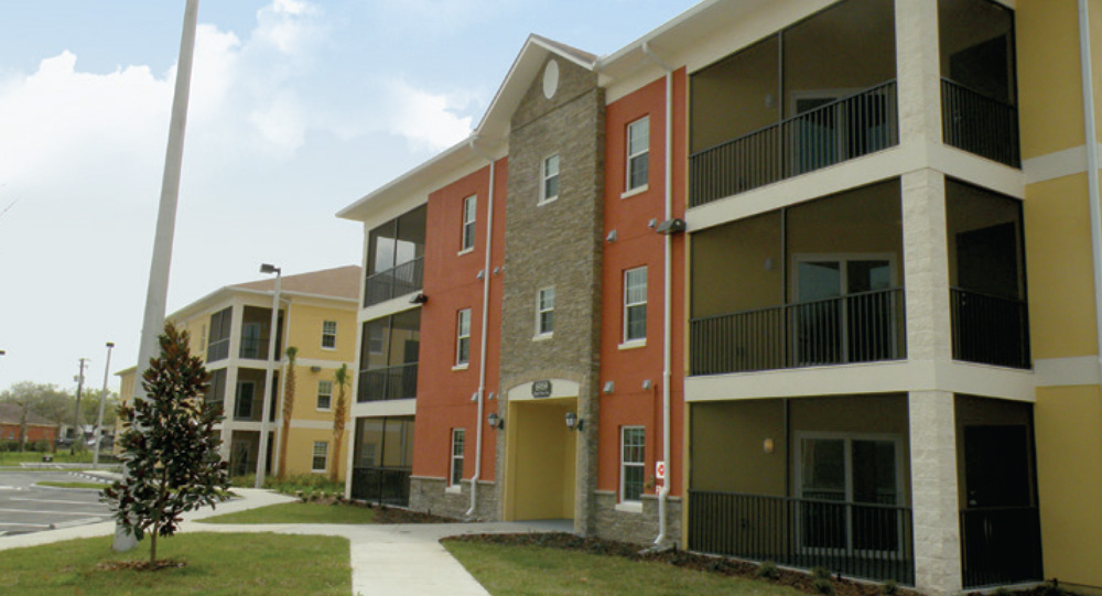 A red and white brick apartment building.