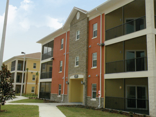 A red and white apartment building.