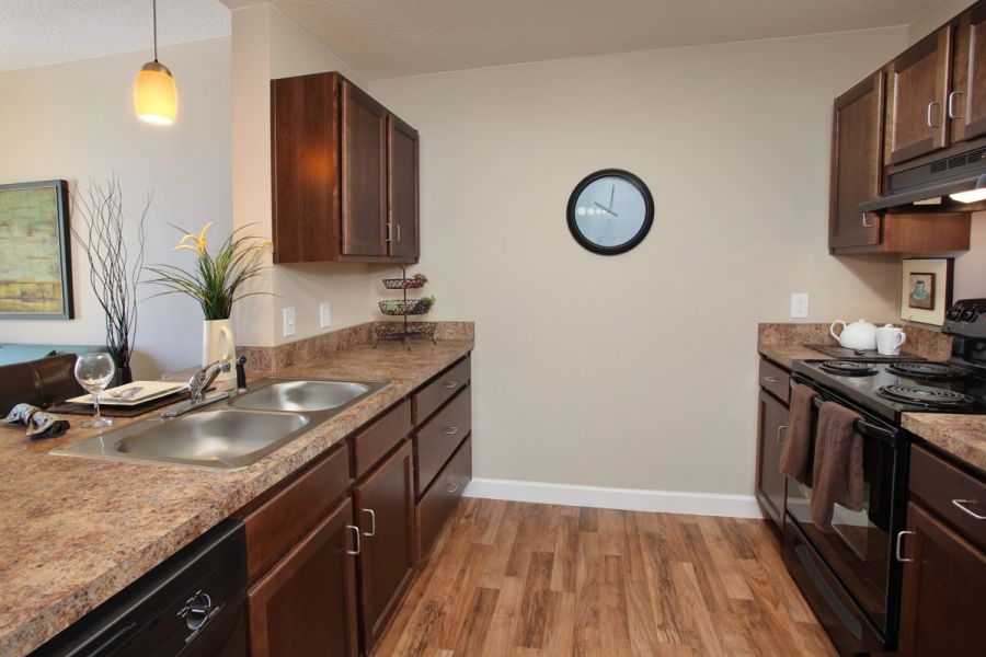 A kitchen area with marble countertops.