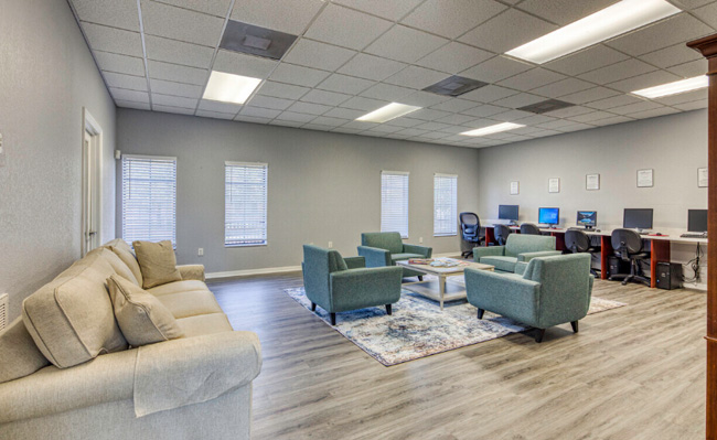 A lounge area with various sofas.