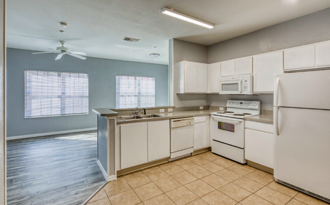 A large kitchen area with bright lighting.