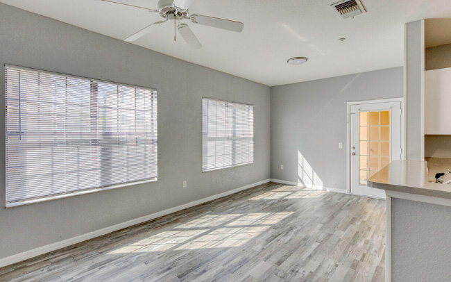 A dining room area with gray colored walls.