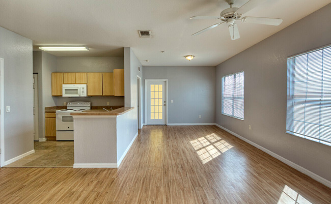 A large dining area with hard wood flooring.