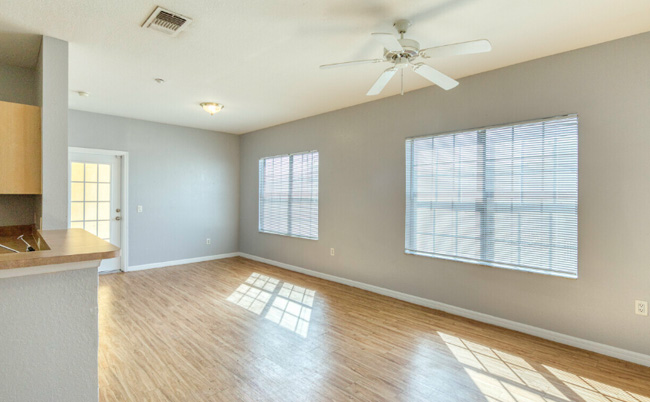 A living room with hard wood flooring.