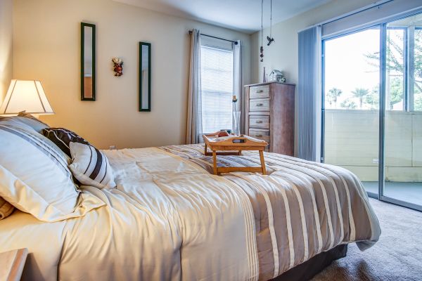 A bedroom area with sliding doors.