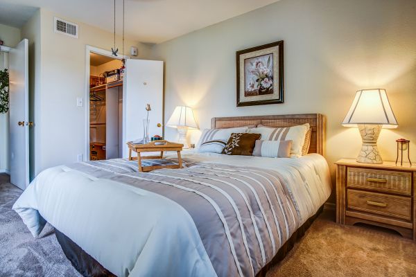 A bedroom area with two night stands.